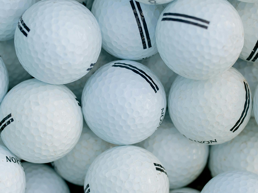 STOCK IMAGE - COLLECTION OF GOLF BALLS